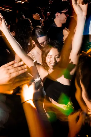 Crowd with hands up at Tudo Bem.zip, August 2026